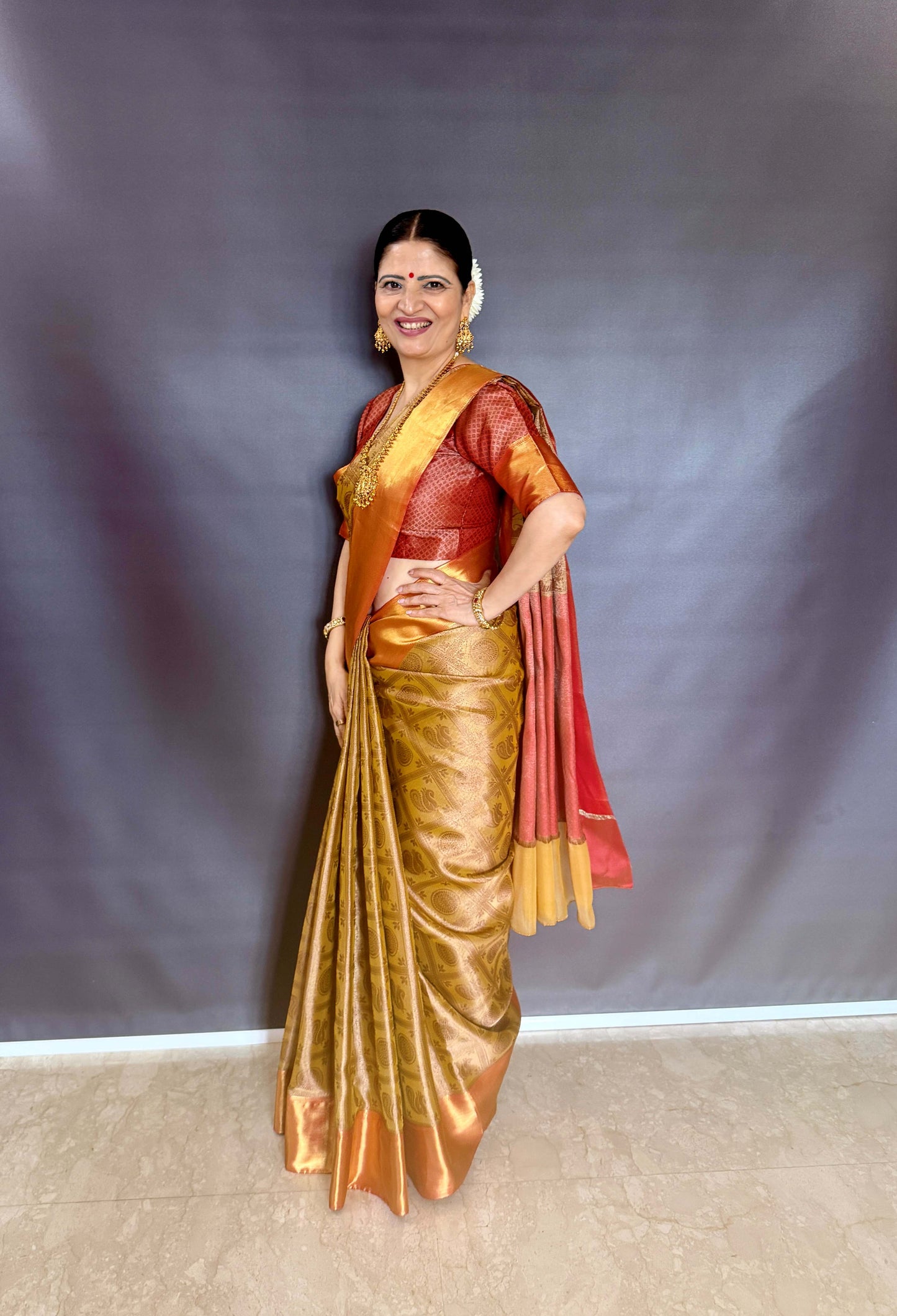 Nita-Inspired Tissue Silk Saree – Gold with Copper Border