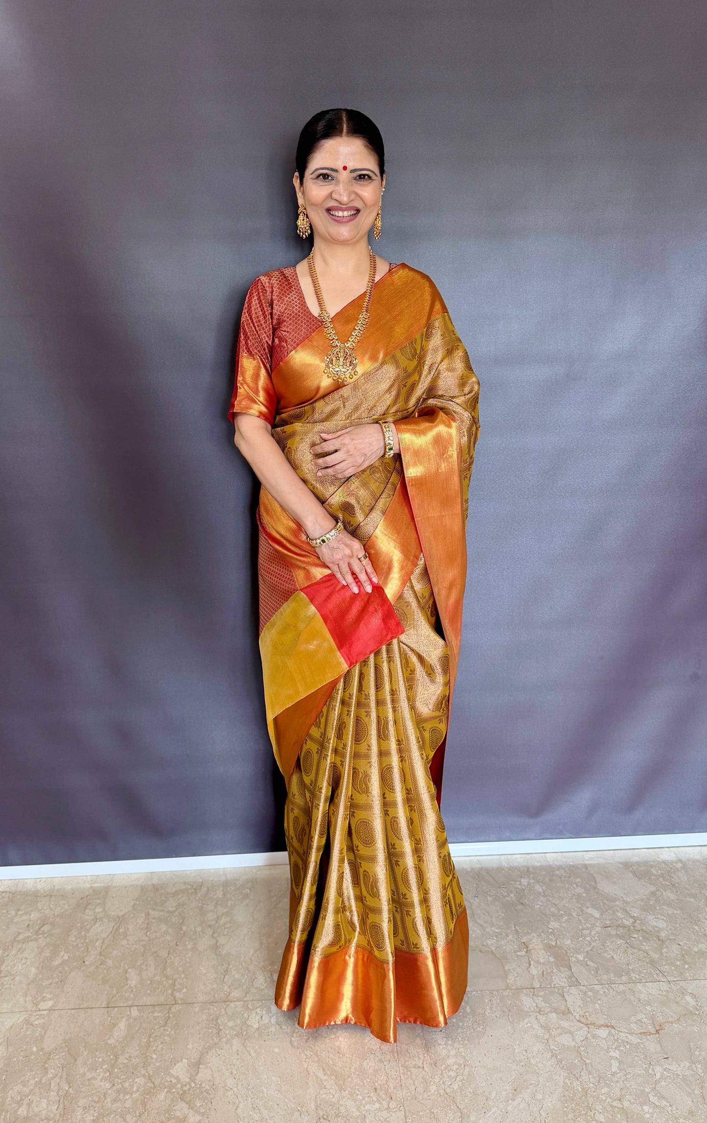 Nita-Inspired Tissue Silk Saree – Gold with Copper Border