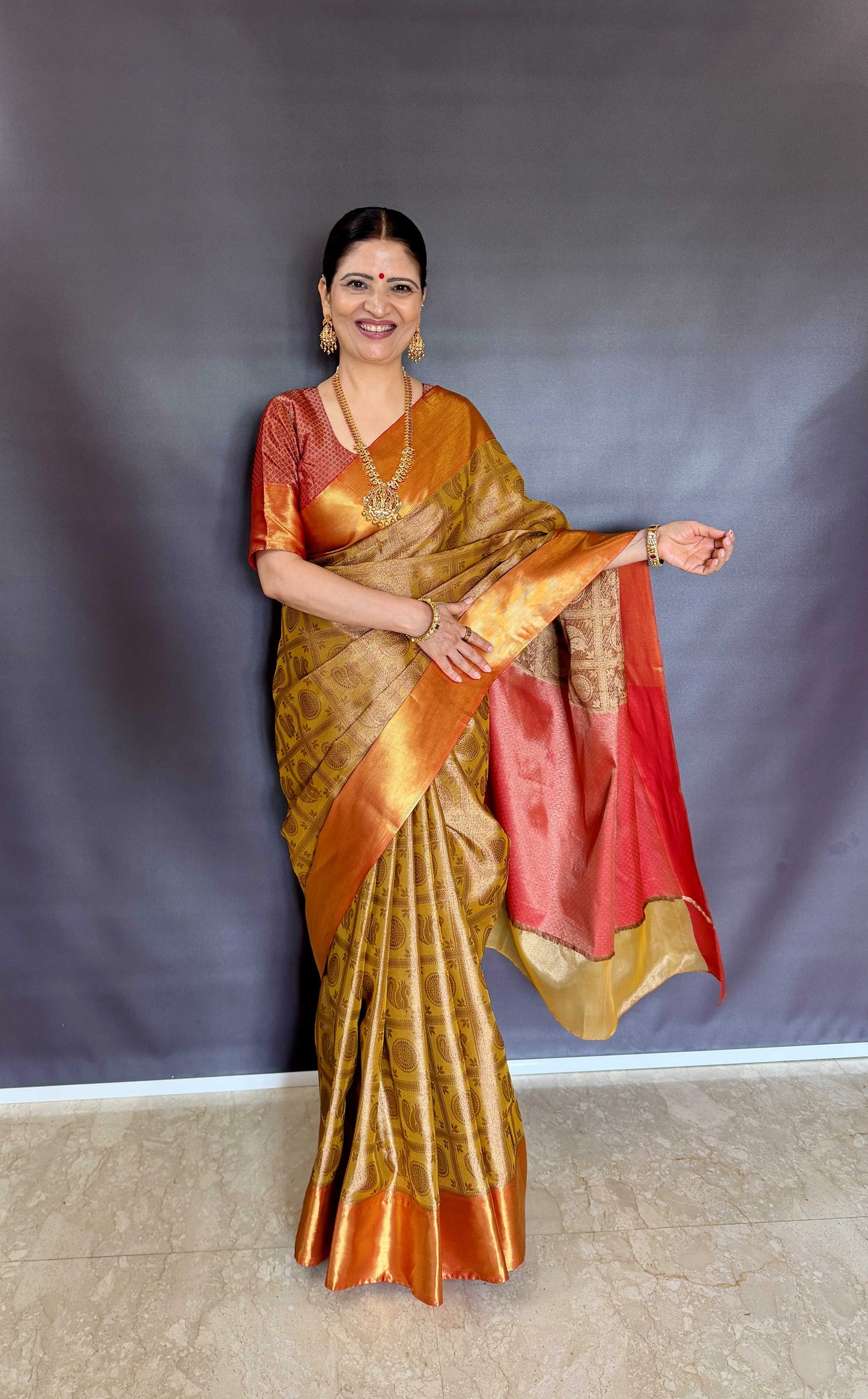 Nita-Inspired Tissue Silk Saree – Gold with Copper Border