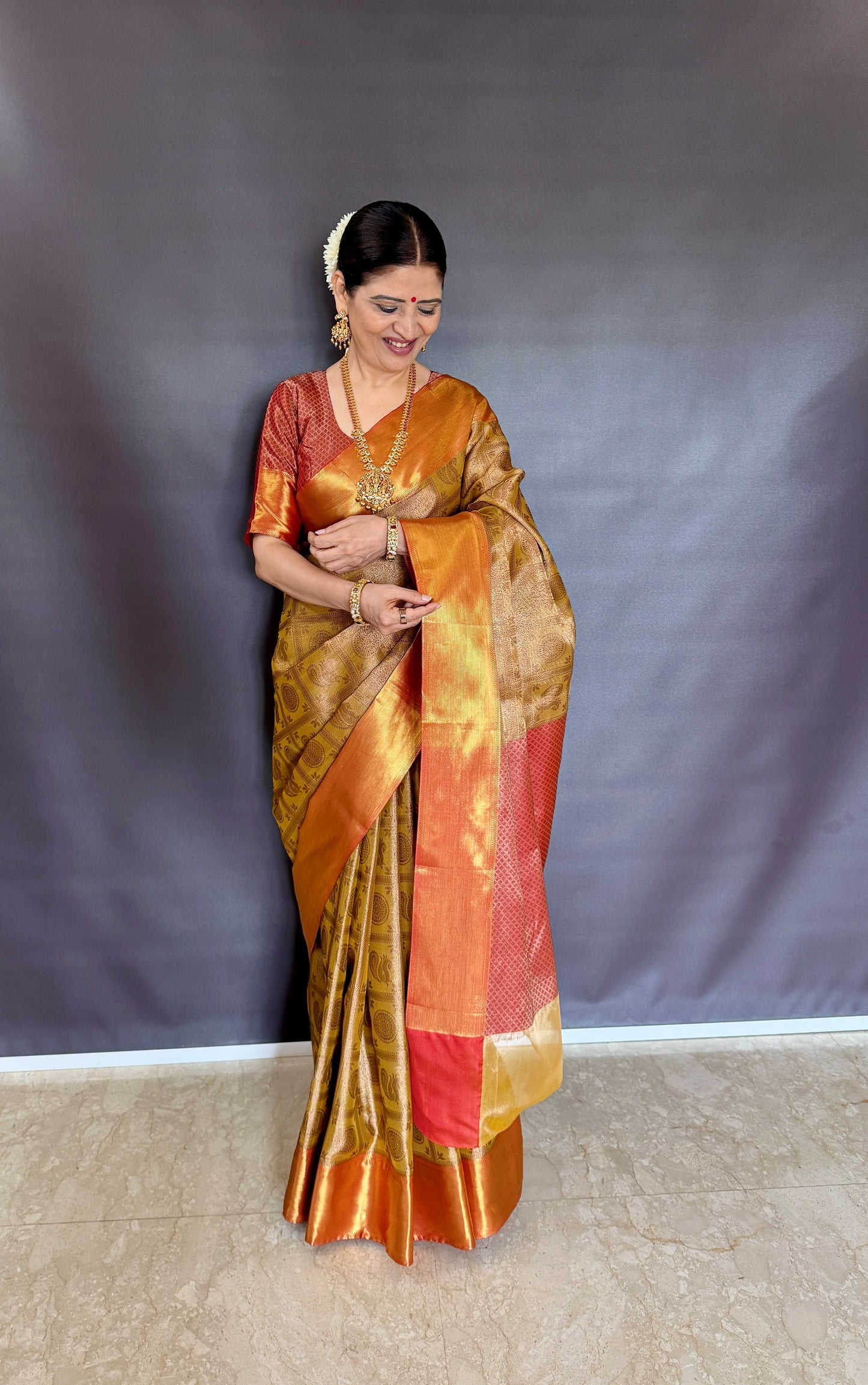 Nita-Inspired Tissue Silk Saree – Gold with Copper Border