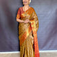 Nita-Inspired Tissue Silk Saree – Gold with Copper Border