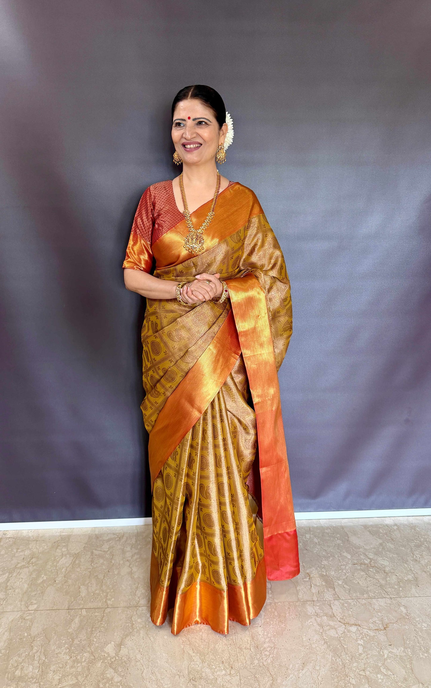 Nita-Inspired Tissue Silk Saree – Gold with Copper Border