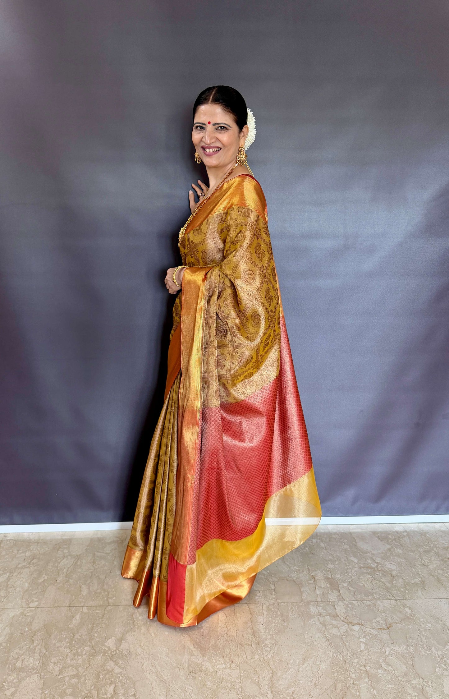 Nita-Inspired Tissue Silk Saree – Gold with Copper Border
