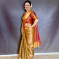 Nita-Inspired Tissue Silk Saree – Gold with Copper Border