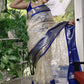 Ivory Embroidered Tissue Silk Saree with Royal Blue Zari Border